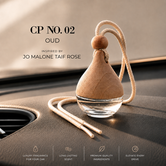 A teardrop-shaped car air freshener with a light wood top, clear glass base, and cream rope loop, resting on a car dashboard. Text on the image reads 'CP No.