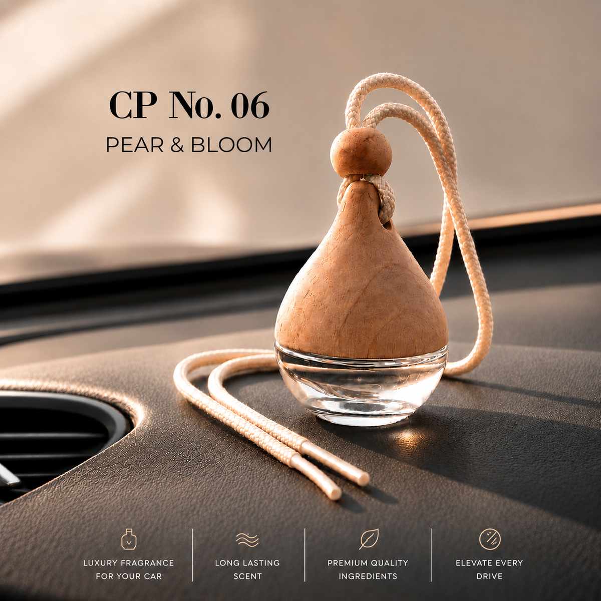 A pear-shaped car air freshener bottle labeled 'CP No. 06 PEAR & BLOOM' resting on a car dashboard. A beautifully fresh blend of juicy ripe pear, delicate freesia and soft floral notes creates an elegant fragrance that feels bright, feminine and effortlessly refined. Crisp, fresh and inviting, Pear &amp; Bloom brings a touch of understated luxury to every drive.