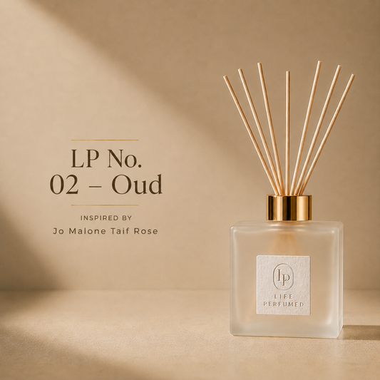 A reed diffuser bottle with natural wood reeds and a gold collar, set on a beige surface against a matching beige background. Text on the left reads 'LP No.